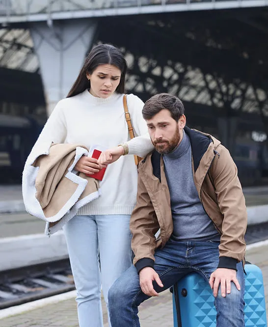 Couple waiting train