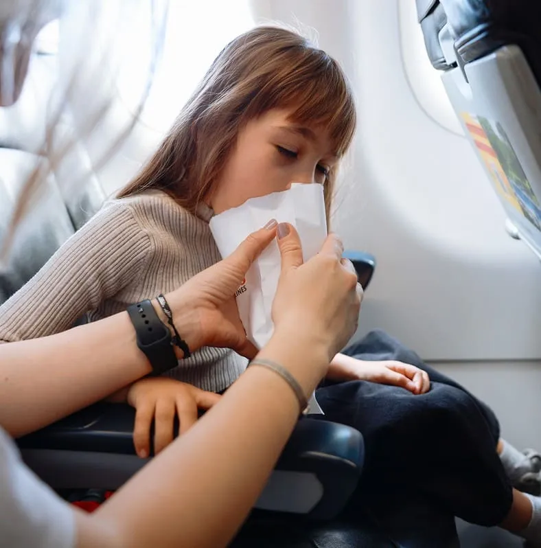 girl vomiting airplane