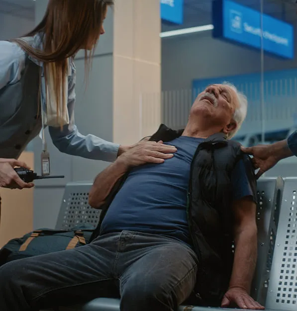 old man getting sick at airport