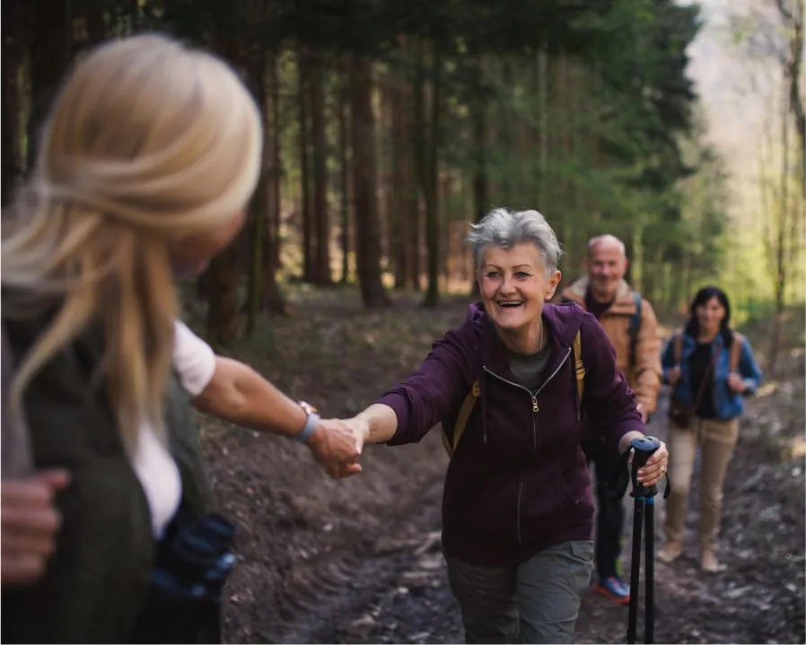 seniors walking in forest