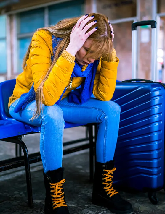 Woman waiting for travel ski