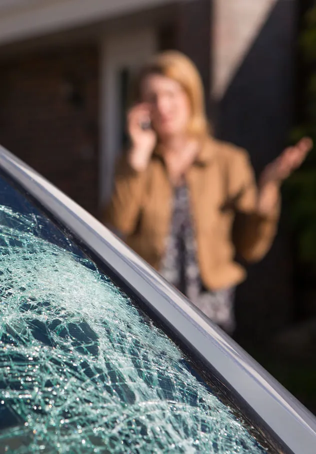 Woman with broken windshield.